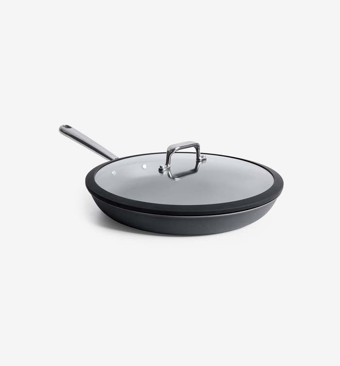 Hard-anodized nonstick frying pan with glass lid and stainless steel handle