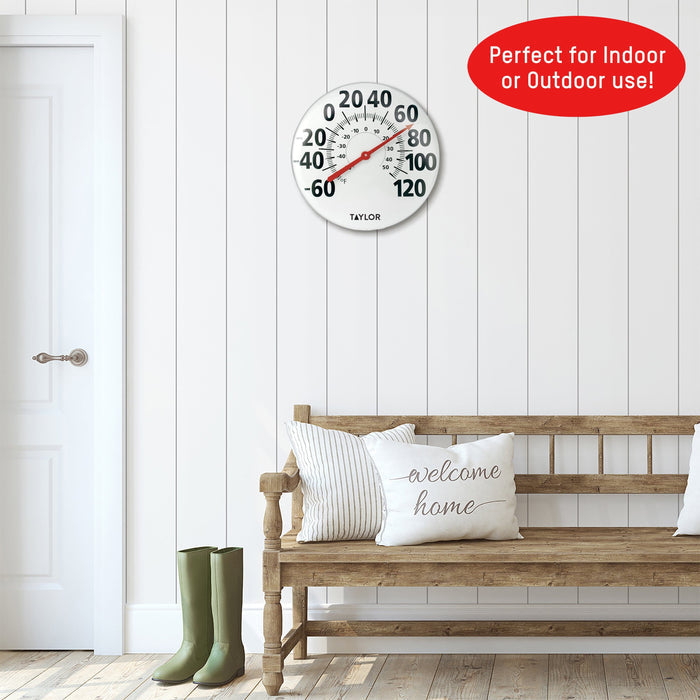 18 inch round metal patio thermometer mounted on white paneled wall with bold numbers