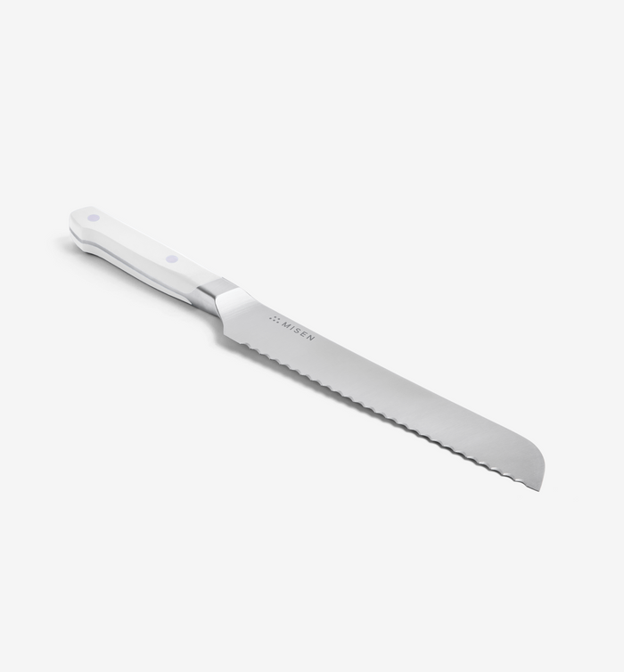 Misen serrated bread knife with white handle and stainless steel blade