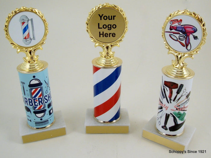 Three trophies with barber shop and salon design columns with the option for a logo at the top (demonstration logos on the left and right and a blank one in the center) on marble bases with gold engraving plates.