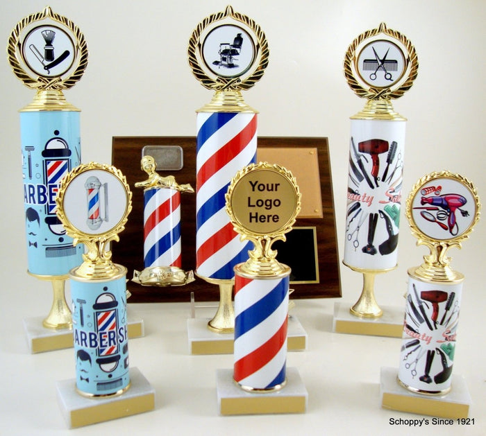 Many barbershop trophies with similar barbershop column and logo designs with a barber shop plaque in the background.