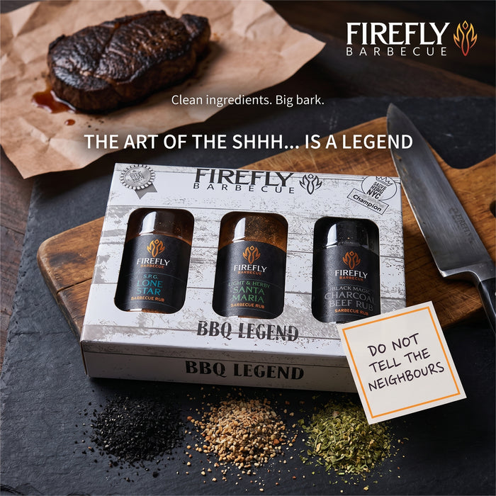 BBQ rub gift set with three spice bottles on wooden surface