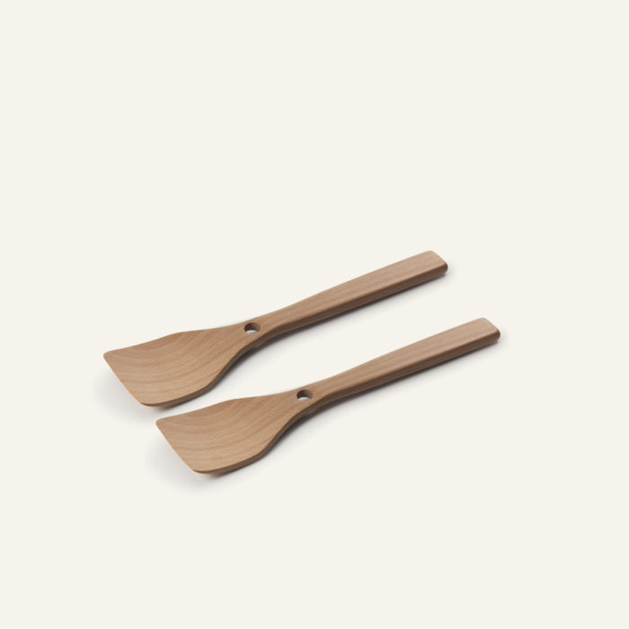 Two Beechwood Spatulas made from natural beechwood, featuring flat angled heads and square handles, are arranged side by side on a simple light background.