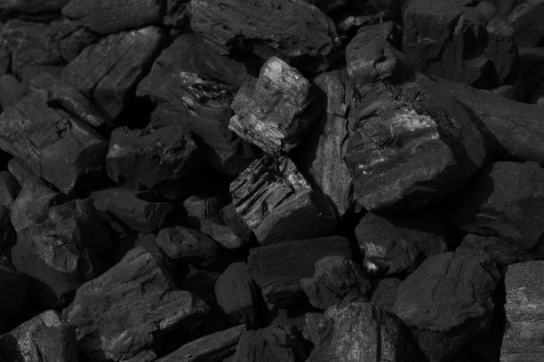 Black lumpwood charcoal pieces for grilling and barbecuing