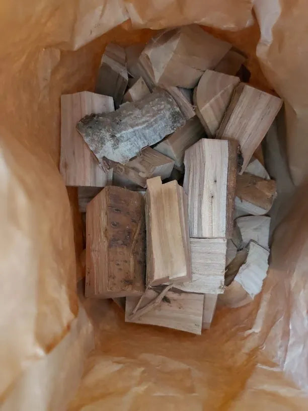 Wood chunks inside paper bag for smoking and grilling