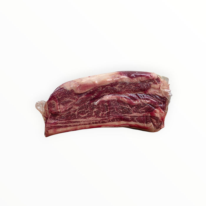 Raw beef short ribs with packaging label