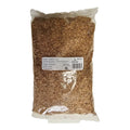 Close-up of chopped alder wood smoking chips in a transparent bag for barbecue