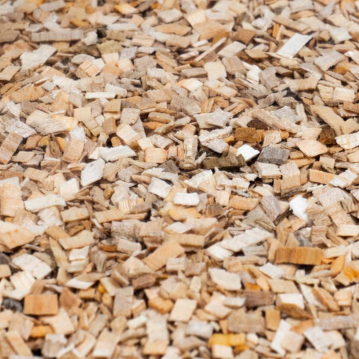 Detailed view of chopped wood chips for smoking meats in packaging