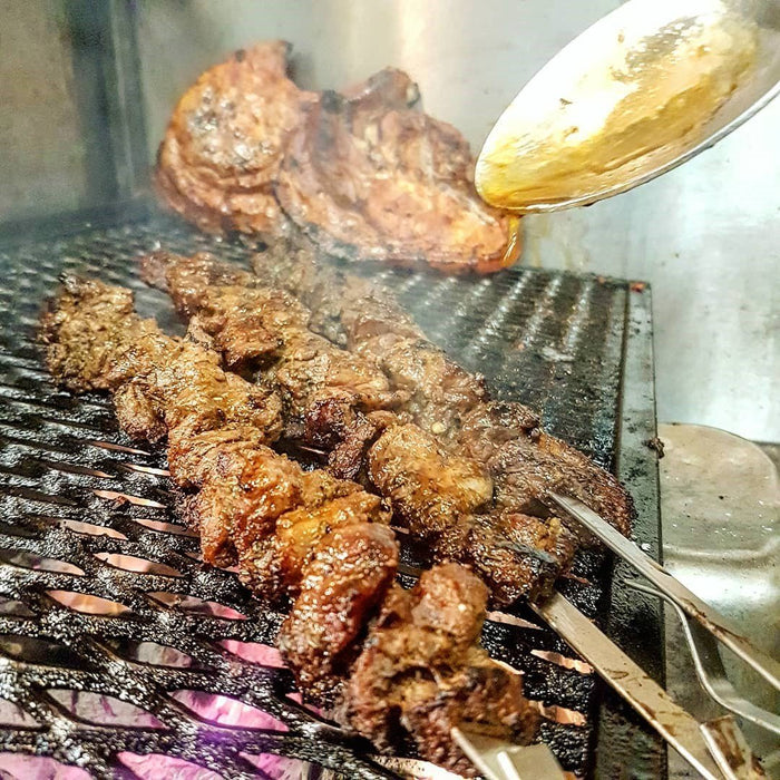 Meat grilling with jerk seasoning