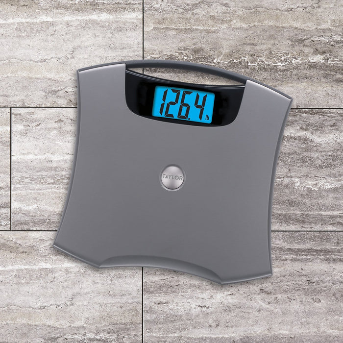 Gray digital bathroom scale with a bright blue backlit display reading 126.4 lb.