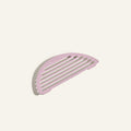 A pink, semi-circular slotted soap dish inspired by the sleek Fry Deck design is displayed on a plain, light-colored background.