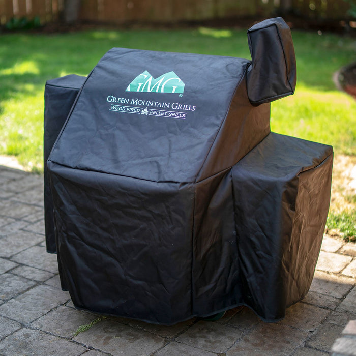 Durable GMG Grill Full-Length Cover on Green Mountain Grill in backyard setting, weather-resistant BBQ accessory - FireFly Barbecue