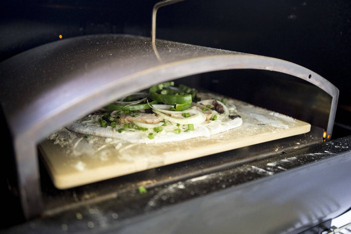 GMG Trek outdoor pizza oven with pizza baking process