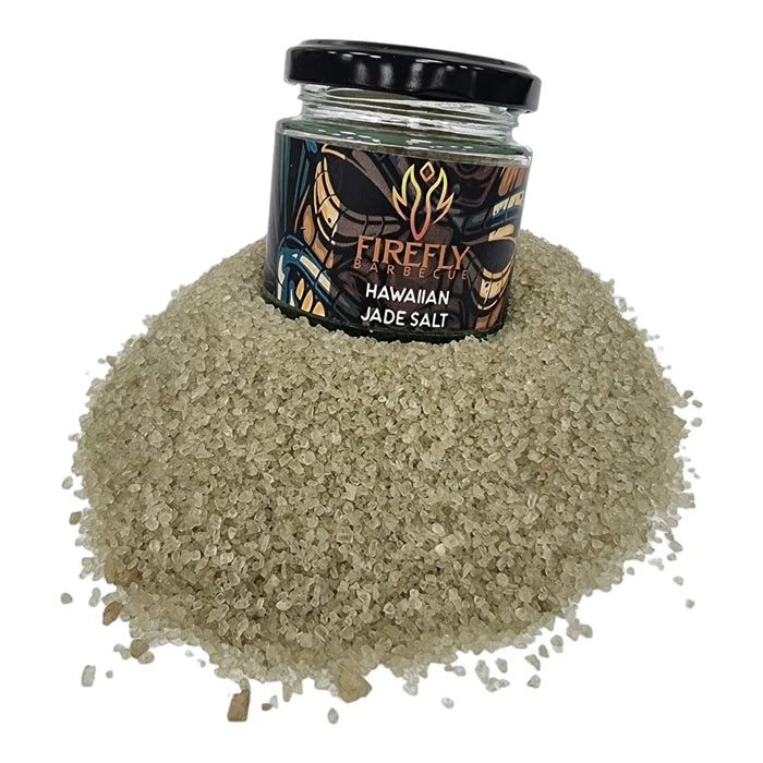 Hawaiian Bamboo Jade Sea Salt jar with black lid on salt mound