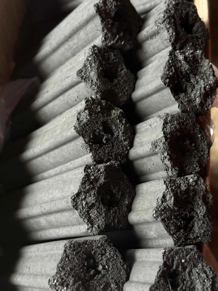 Charcoal briquettes stacked for BBQ grilling