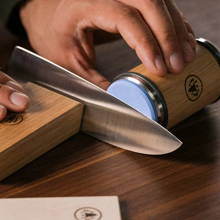 Using Horl 3 whetstone with knife on wooden block