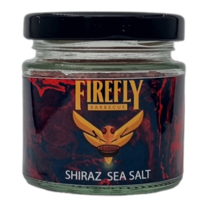 Stacked jars of flavored sea salts with colorful labels for gourmet seasoning