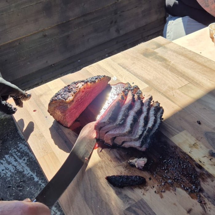 Cooked beef steak on wooden table with Firefly Barbecue rubs