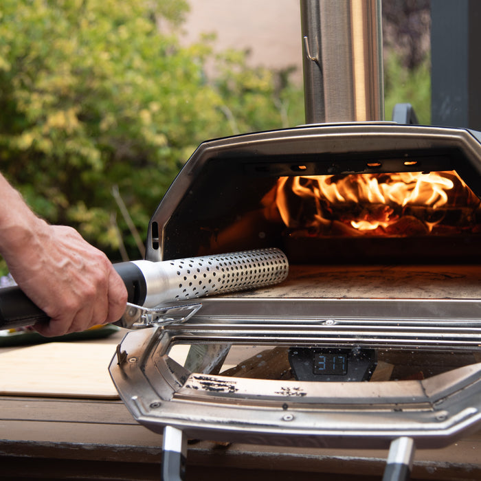 Close-up of electric grill fire starter with power cord outdoors