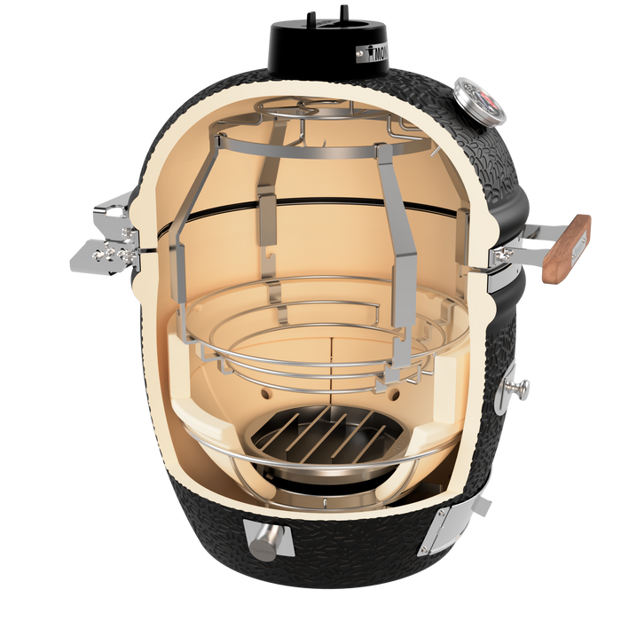 Monolith outdoor grill with internal heating chamber and metal cooking grate
