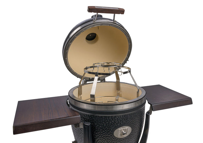 Monolith ceramic outdoor grill with internal heating chamber and metal grate