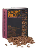 Box of wood pellets with black and orange packaging and pellets
