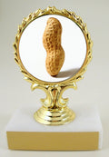 A trophy featuring a three-dimensional peanut character in the center, with a gold-colored award ribbon above it, mounted on a white base.