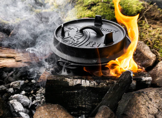 Petromax 1.6L cast iron Dutch oven cooking over campfire