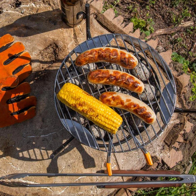 Petromax grilling grate used for smoking and baking on outdoor grill