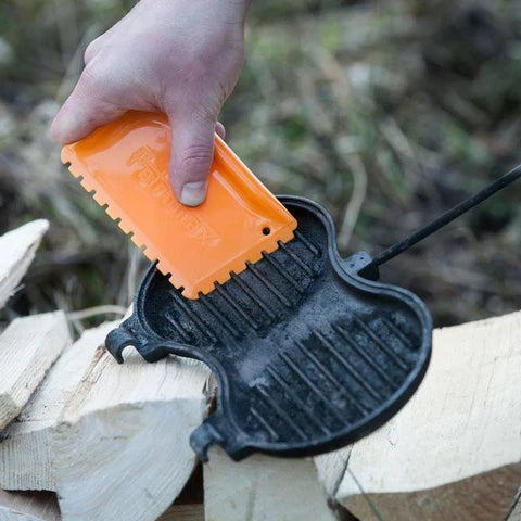 Petromax Dutch Oven Scraper being used to clean cast iron