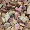 Stack of pinkish wood chunks for smoking and grilling
