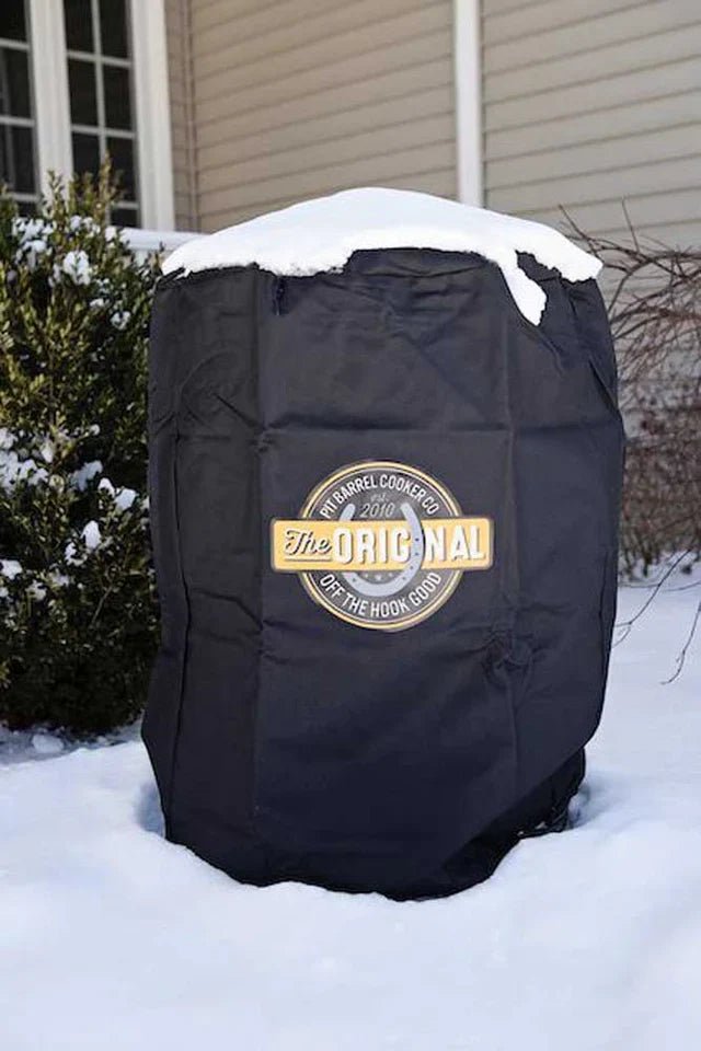Pit Barrel Custom Fit Cover - FireFly Barbecue in snowy outdoor setting, highlighting all-weather protection for Pit Barrel smokers.