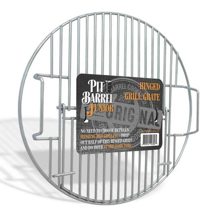 Pit Barrel Junior Hinged Grill Grate in packaging, labeled for dual-use cooking with easy drop-out hinge for hanging and grilling.