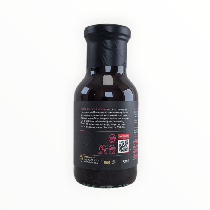 Side view of Raspberry Chipotle BBQ Sauce bottle with ingredients