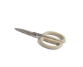 The Shear Genius kitchen shears, made of stainless steel with beige plastic handles, are displayed on a white surface to highlight their multifunctional design.