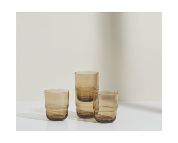 Three Short Night + Day Glasses in brown recycled glass, each a different height, are displayed on a white surface with a simple light background.