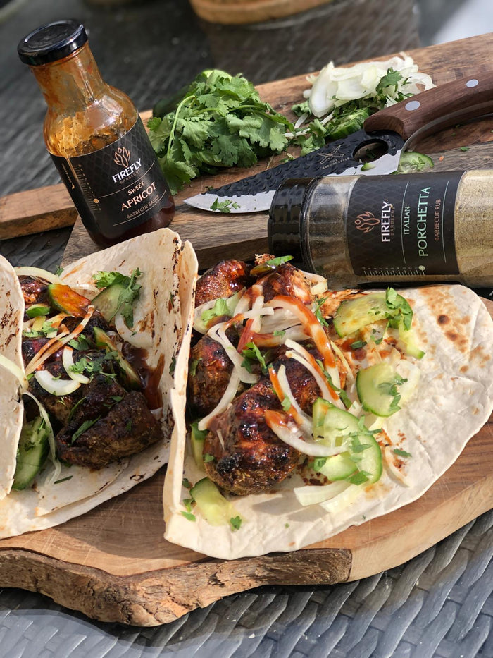 Barbecue sauce bottle with grilled meat and vegetables