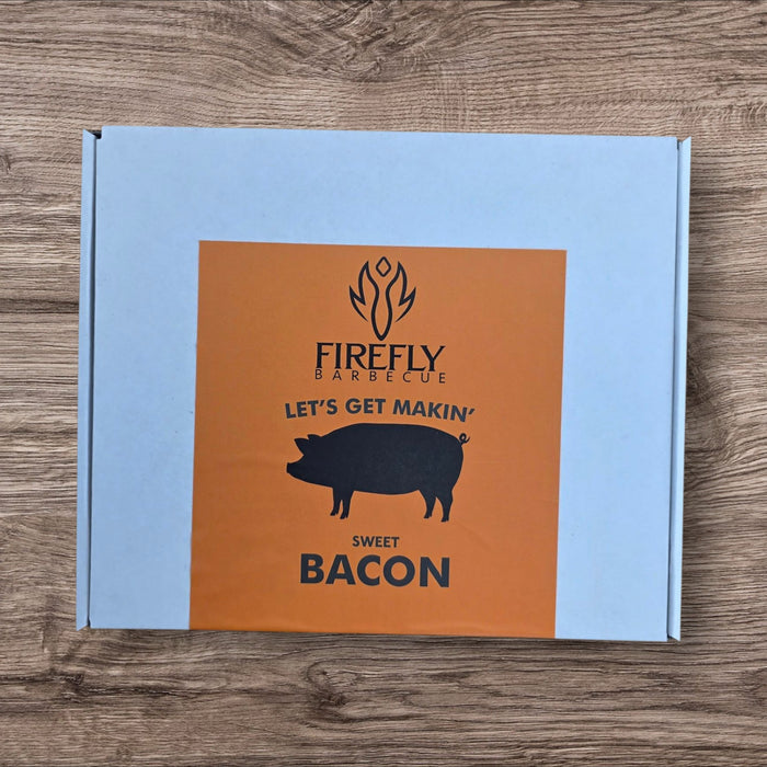 Raw bacon slices on wooden cutting board for home bacon curing