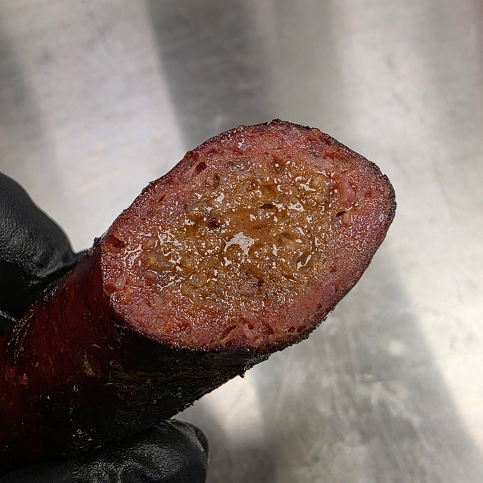Cooking sausages on barbecue grill
