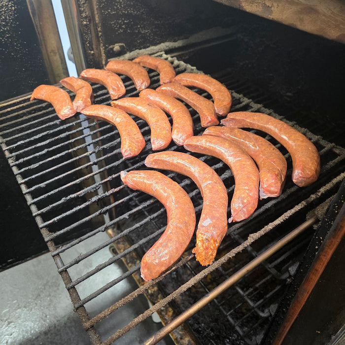 Sausages grilling on barbecue