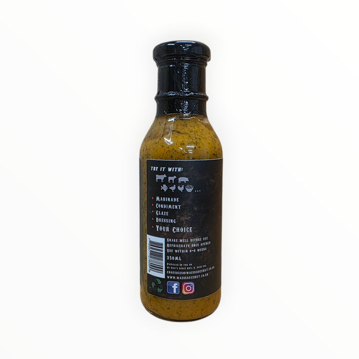 The Asado Apricot Chimichurri Sauce bottle with ingredients and herbs around