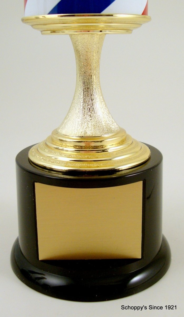 Close-up of the black round base and gold engraving plate