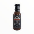 Black bottle of Waz's Sauce Honey Rum Chipotle BBQ